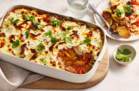 Turn leftover roast lamb into a delicious moussaka with this easy recipe that uses a jar of sauce and frozen Mediterranean-style vegetables as a cheat's way of getting dinner on the table quicker.