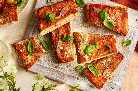 This Sicilian-inspired pizza, made with pre-baked focaccia, takes only 15 minutes to make and is full of sophisticated flavours. Great for a quick lunch, snack or served as part of a summer party spread.