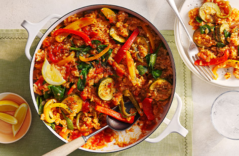 Whip up a Spanish-inspired paella in 35 minutes. Packed full with summer veggies, this vibrant dish is a great midweek meal idea.
