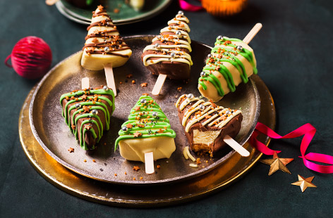 Have fun decorating these cute cheesecake Christmas trees, and enjoy eating them too! Made with shop bought vanilla cheesecake, this low-effort dessert is a festive winner.