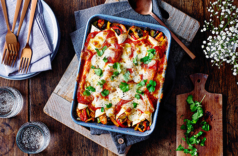Load tortillas with paprika-spiced chicken, red pepper, beans and gooey mozzarella cheese to make this warming enchilada recipe. This easy chicken enchilada recipe is sure to be enjoyed by all - bake until the cheese is golden and bubbling and tuck in!