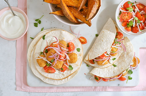 The kids will love this fun twist on tacos. Load tortilla wraps with chicken nuggets, tomato salsa and crunchy veg for a summer dinner that bound to go down a treat.