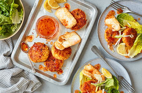 Make these crisp chickpea fritters for an all-day treat - a hearty late brunch, weekend lunch or quick dinner idea. The spicy fritters are packed with hidden veg and topped with slices of golden fried halloumi and a drizzle of chilli sauce.