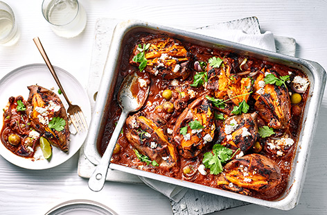 Save time this summer and batch cook this easy vegetarian baked sweet potato recipe. Simply smother sweet potatoes in spicy chipotle paste, bake in the oven and top with black beans, sharp green olives, tangy feta and plenty of fresh lime and coriander.