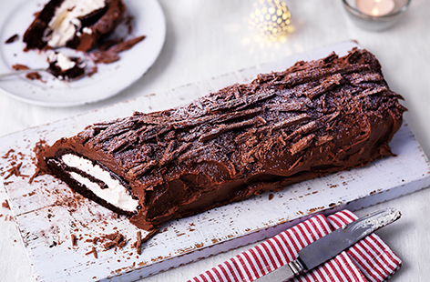 This traditional chocolate yule log recipe, or Bûche de Noël, makes a deliciously indulgent Christmas dessert. The rich, chocolate sponge is rolled with a whipped Irish cream filling and covered in a boozy chocolate icing. The Swiss roll-style cake is then finished with crumbled chocolate 'bark' for a true log effect. Find out how to make yule log with our step-by-step recipe.