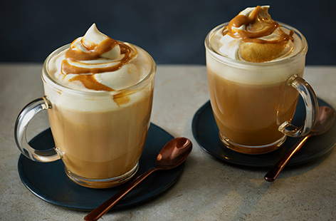 Cosy up with a warming cinnamon bun latte. This sweet bun-inspired coffee is topped with cinnamon-flavoured cream, it's the perfect autumn mugful.