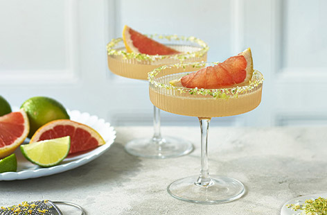 A zingy margarita is a classic cocktail, so why not add refreshing grapefruit for a citrusy twist on this tequila-based drink. For even more tanginess, we've added salt and grapefruit zest to the rim.