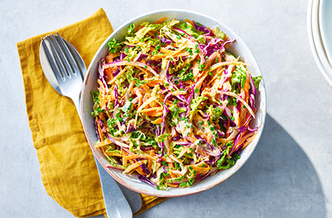 Cabbage, onion and carrot are shredded and then coated in a creamy dressing spiked with a little mustard and vinegar, making for a truly fabulous coleslaw - the perfect burger side!