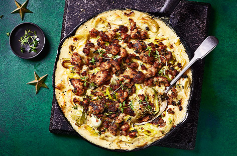 These creamy mustard leeks are topped with crumbled sausages and cheese for an indulgent side dish or why not serve as a hearty main over the Christmas holidays?