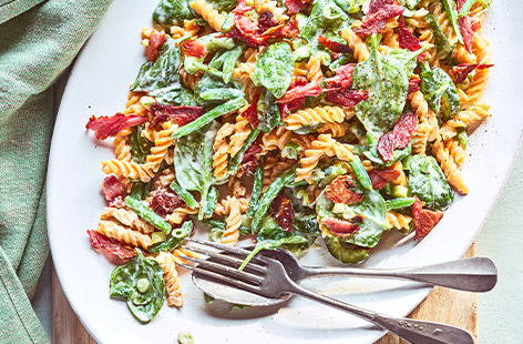 Serve up this creamy pasta salad for those warm summer evenings. With crispy bacon and greens beans in a lemon crème fraîche sauce, this dish will go a hit with the whole family.
