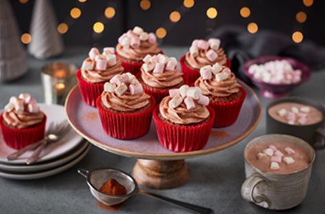 Warming and comforting, these little cakes, spiced with cinnamon, take all that we love from a hot chocolate and deliver it in cupcake form!