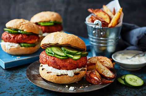 Try a new vegetarian burger recipe with these feta falafel burgers. Make crisp chickpea patties flavoured with plenty of garlic, oregano and tomatoes for a thick falafel burger, then layer into buns with a tangy feta and yogurt sauce and fresh cucumber.