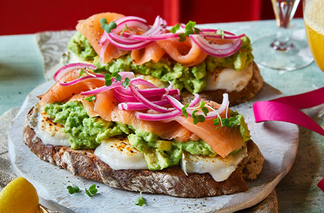 Smoked salmon and avocado on toast gets a Christmassy makeover with the delicious additions of goat's cheese, pickled red onion and seedy rye sourdough. Serve with Buck's fizz for a special start to Christmas Day.