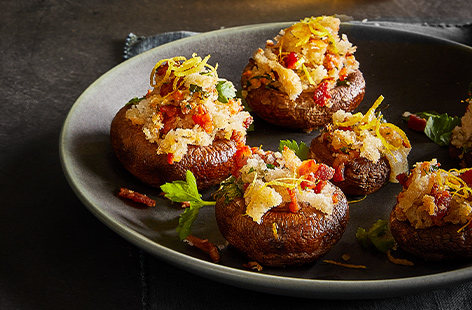 The flavour in these stuffed mushrooms are turned up to 11, with smoky bacon, nutty Manchego and lemon zest combining for a simple snack that will wow the crowd