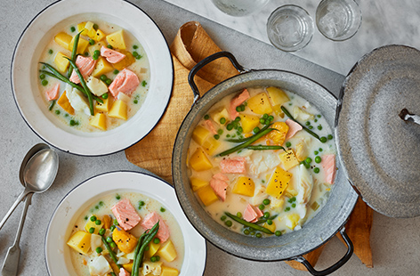 This creamy fish stew is filled with a triple combination of smoked haddock, cod and salmon for maximum flavour. Add plenty of green beans and peas for extra veg in this one-pot meal.