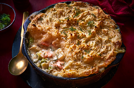 We've pepped up a classic fish pie with salty capers, zingy lemon and fragrant dill, served with an earthy celeriac mash. It's the perfect comforting and luxurious dish to enjoy with friends on a chilly evening, or freeze portions for easy midweek meals.