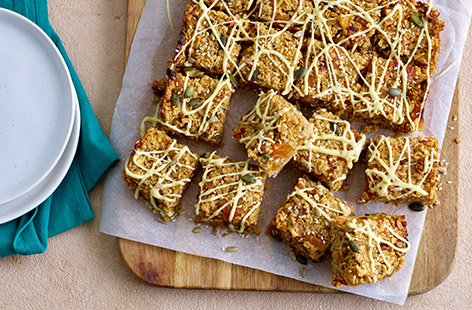 Load your flapjacks with fresh apple and dried apricots for a delicious twist on a classic bake that provides 1 of your 5-a-day. These are great for lunchboxes or snacking on the go.
