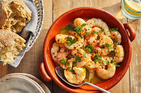 A tapas classic, pan-fried prawns are quick, easy and bursting with flavours of the Mediterranean