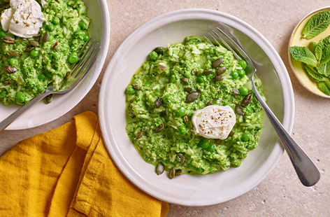 Craving a risotto but short of time? Try this quick and easy recipe, brimming with green veg and made with long-grain rice – no need to buy special risotto rice. The addition of soft cheese means it's creamy yet low in fat - bonus!