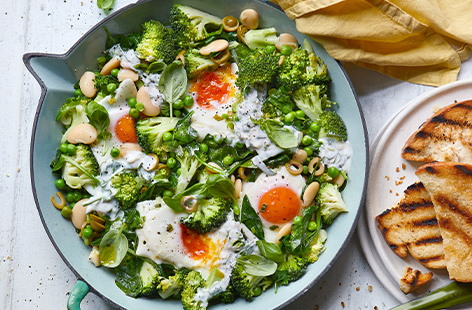 Vibrant greens and runny eggs combine for a simple savoury bake, ideal for a light dinner