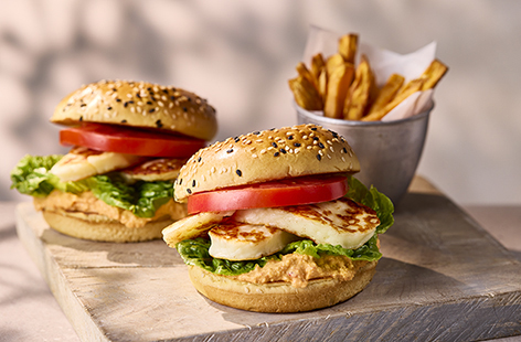 Swap out your beef burger with this tasty vegetarian halloumi burger. Topped with crunchy vegetables and rich houmous, it's colourful and satisfying. Serve with skinny sweet potato fries for the ultimate treat.