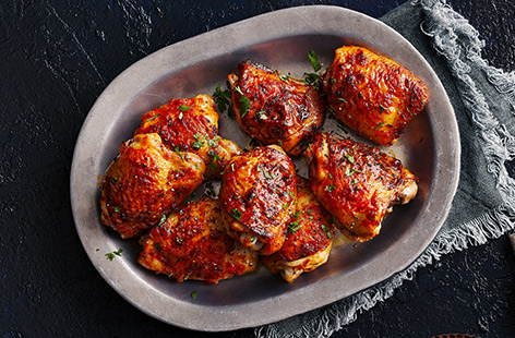 Sweet honey is married with spicy harissa, garlic, lemon and parsley in this easy chicken thigh recipe. 