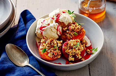 There aren't many dessert options more satisfying than sweet, caramelised fruit, cooling ice-cream, and crunchy granola