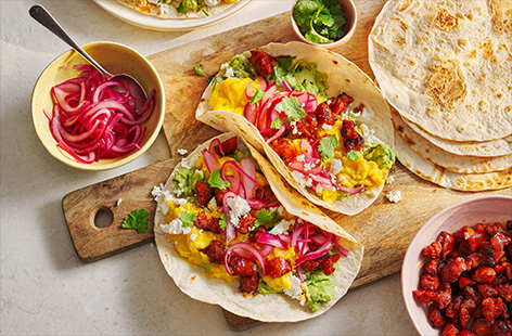 These breakfast tacos are worth getting up for! Load your tortillas with smashed avocado, scrambled egg and plenty of chorizo for big Mexican flavours. Perfect for a special weekend brunch.