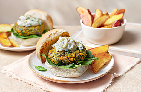 These vegan pakora burgers are a great way to up your family's veg intake. The patties are packed with spinach, chickpeas, carrots and a dash of garam masala for a little heat. Serve in rolls with a dollop of cooling raita alongside homemade potato wedges. 