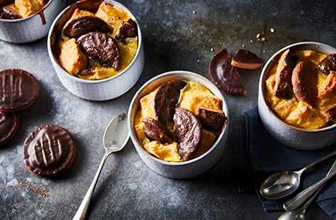 Give a traditional British dessert a fun, indulgent spin with this mini Jaffa cake bread and butter puddings recipe. Chopped Jaffa cakes replace half the usual bread and are soaked in orange custard before being baked until golden for a rich winter pud.