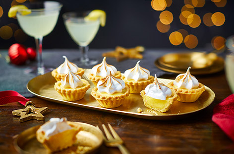 Impress party guests with these little lemon tarts made with shop-bought pastry cases and a creamy lemon curd filling. 