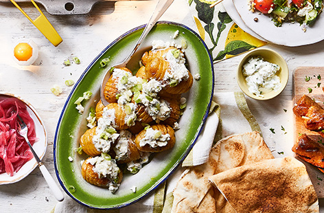 Move over potato salad, there's a new summer side dish in town. These crispy hasselback potatoes are loaded with a delicious garlicky yoghurt dressing, spring onions, fresh parsley and feta.