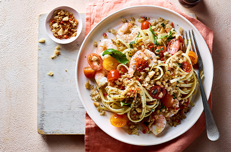 Sweet cherry tomatoes and decadent prawns combine for a luxurious pasta dish, topped with golden breadcrumbs for that wow factor
