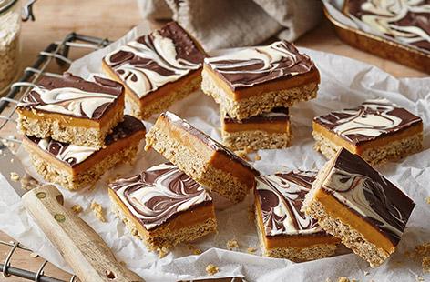 This well-known treat gets a makeover with a banana flapjack base, sweet caramel layer and a gorgeous marbled chocolate topping
