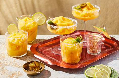 This Mexican-inspired cocktail has a fruity twist with juicy frozen mango. Ideal for a hot summer's day, fill up a jug and garnish with jalapeños for a little spice. 