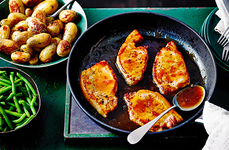 Coat tender pork loin in a sticky marmalade glaze in this easy autumn dinner idea. Serve with herby thyme-roasted potatoes and simple green beans.