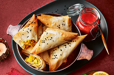 Stuff filo pastry with spiced potatoes, chilli and onion then bake until golden and crispy. Serve with a fiery tomato and garlic chutney - perfect for your Diwali celebrations! 