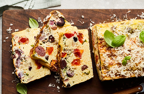 This high-protein frittata is baked in a loaf tin so you can easily pack it for an on-the-go lunch or snack. Cottage cheese boosts the protein and olives and Parmesan add moreish, savoury flavours.