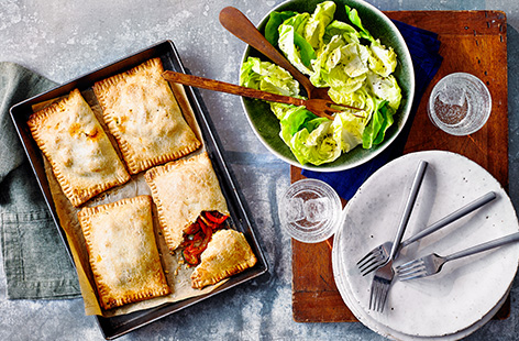 Give a classic British pasty a Mediterranean spin with this veggie pasties recipe. Buttery shortcrust pastry is filled with courgettes, peppers and red onion in a simple herby tomato sauce for an easy savoury bake.