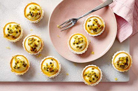 These mini fruit tarts are a great no-cook addition to your afternoon tea. Buttery pastry is filled with zesty lemon curd, cream and passion fruit seeds. These little bites of goodness are sure to go down a treat. 