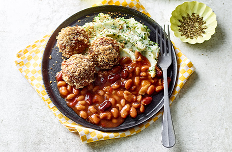 A meatloaf shines in its simplicity for a hearty family dinner, and this dish brings it to the next level with a helping of smoky BBQ beans