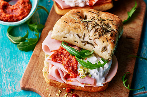 Transport yourself to Italy with this epic sandwich filled with spicy Italian sausage, creamy burrata and punchy red pesto. Ready in 10, this is a really lovely lunch to enjoy in the sunshine.
