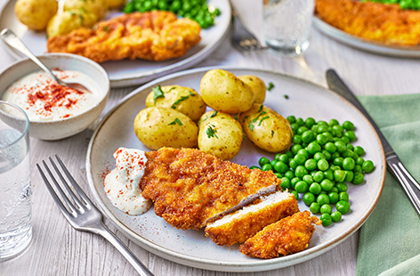 Crispy fried chicken sounds like a weekend treat, but this tasty recipe using spicy tortilla chips is air-fried making it speedy, succulent and lighter than your favourite fried chicken dish. Serve with potatoes and peas for a really enjoyable meal any night of the week.