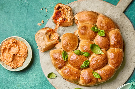 Salty, cheesy and a little bit spicy, you won't be able to get enough of these dough balls. This foolproof recipe uses sourdough pizza base mix for an easy bake. Stuff with 'nduja and mozzarella and whip up a balsamic pesto sauce for dipping - check out that cheese pull! 