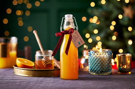 Use this Christmas-spiced orange and honey syrup in cocktails for a festive burst of flavour