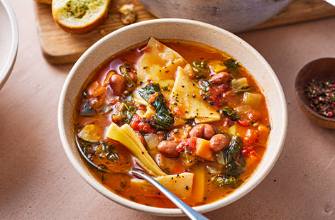 Whip up a delicious and comforting soup in just 30 minutes. Made using frozen veg and borlotti beans and served with garlic bread, this is the perfect warming, winter bowlful.