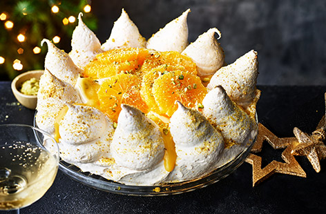 With zesty segments of orange and crushed pistachios this easy Christmas Pavlova is the perfect pud for the big day