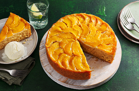 Upside down and peachy all over, this delicious cake has a hint of almond for a nutty flavour