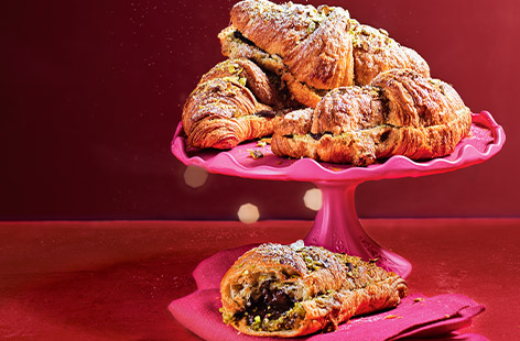 Jazz up leftover croissants with a luxe filling of pistachio frangipane and dark chocolate then bake until crisp, golden and gooey. Serve for breakfast for the ultimate indulgence or for dessert. It's the treat you didn't know you needed.