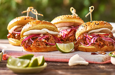Tender, spiced pulled pork goes perfectly with tangy pickled apple in these sliders.